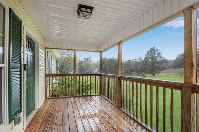 a view of a balcony with wooden floor