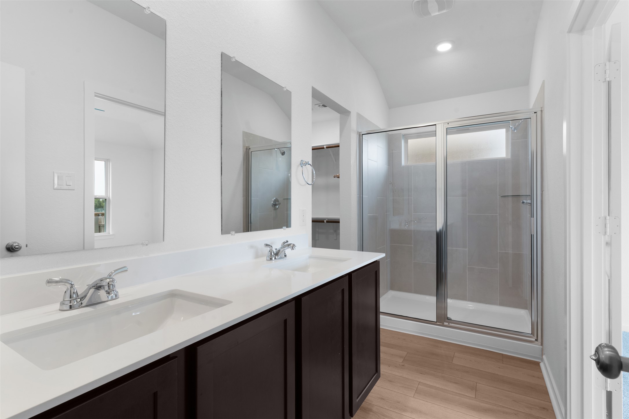 13701 Tucker Hedge Pass Elgin, TX 78621 - Photo 14 of 21 Bathroom featuring a dual vanity with undermount sinks, chrome fixtures, and a white countertop