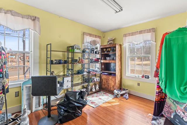 a bedroom with furniture and a window