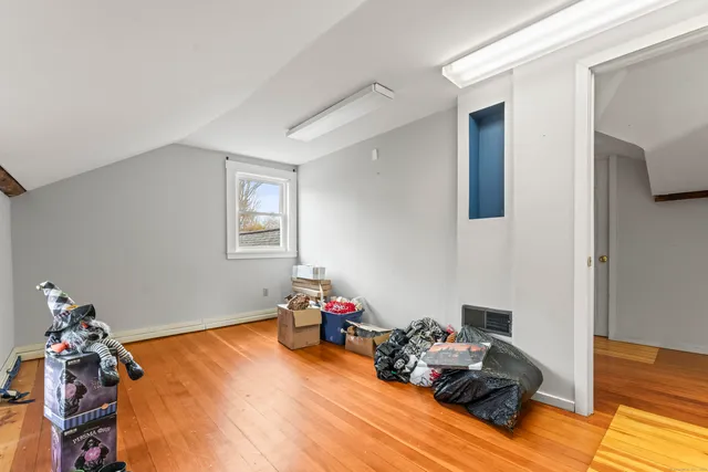 a bed room with furniture and a window