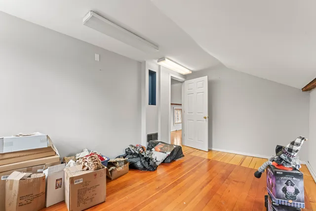 a bedroom with a bed and a tv