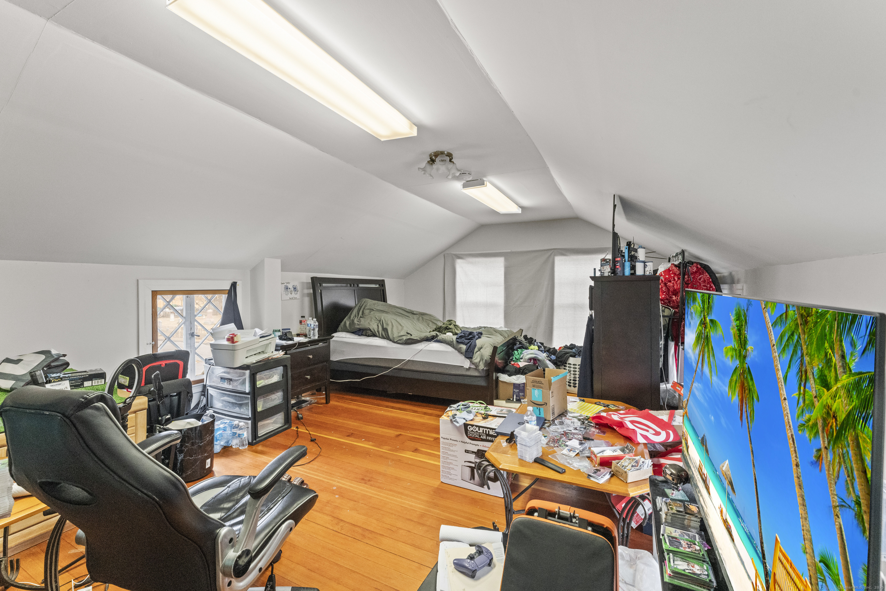 287 Hazard Avenue Enfield, CT 06082 - Photo 24 of 28 a living room with furniture fireplace and a flat screen tv