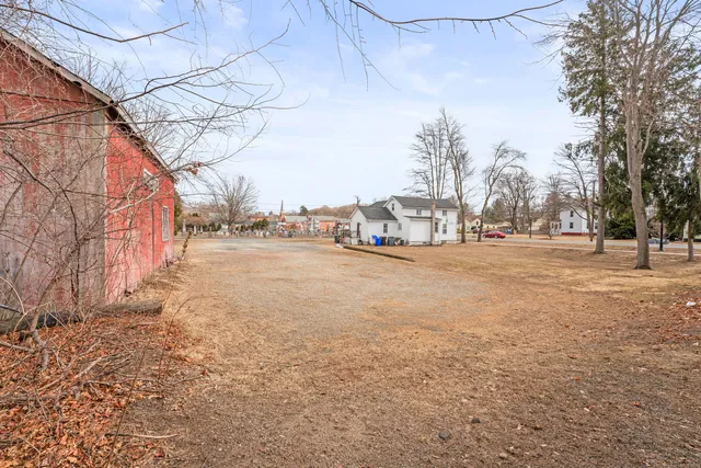 a view of a road with a building in the background