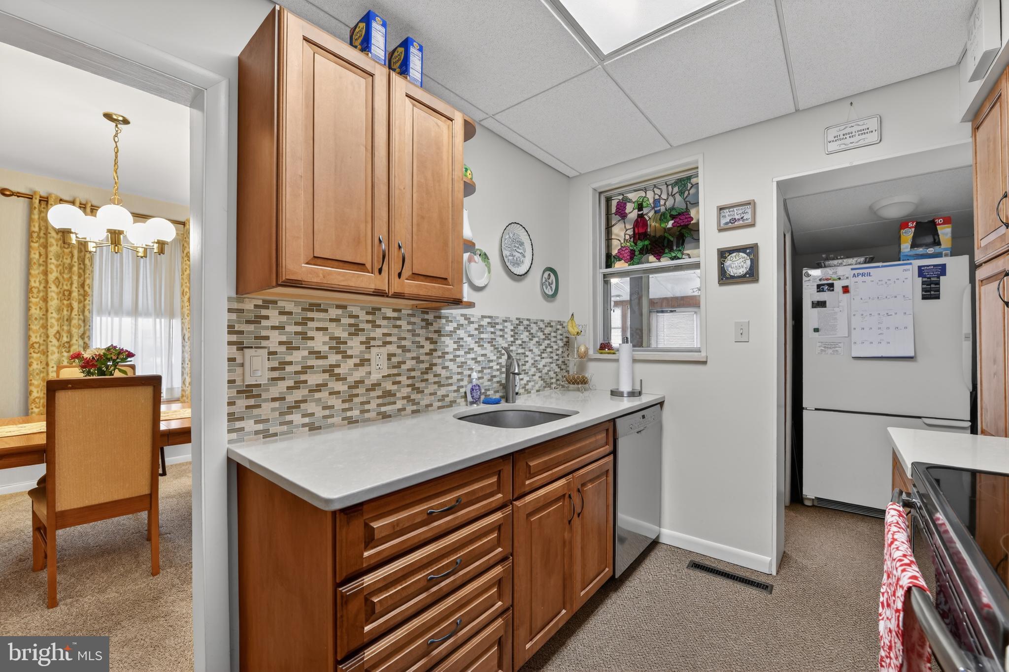 397 Pine Street Reading, PA 19611 - Photo 13 of 42 a kitchen with stainless steel appliances granite countertop a sink stove and refrigerator