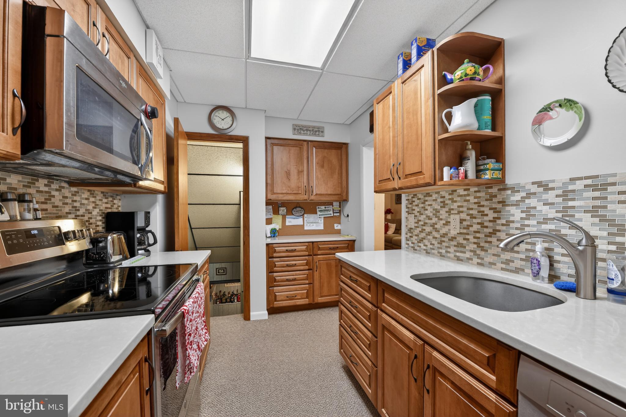 397 Pine Street Reading, PA 19611 - Photo 14 of 42 a kitchen that has a lot of cabinets in it