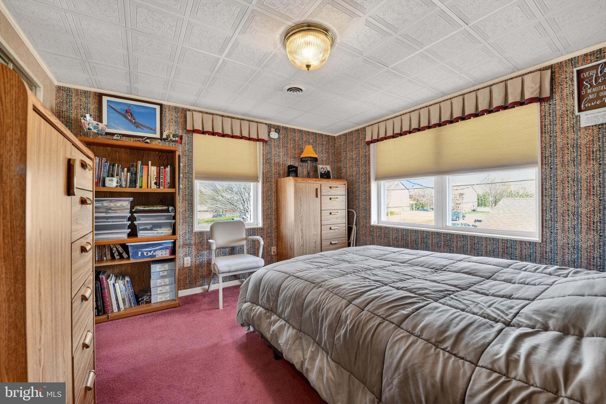 397 Pine Street Reading, PA 19611 - Photo 18 of 42 a bedroom with a bed window and a book shelf