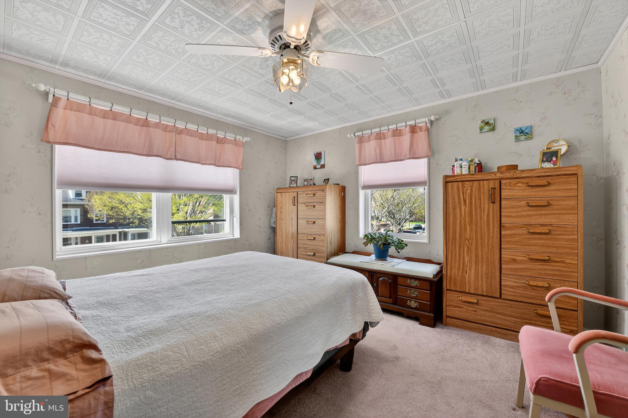 397 Pine Street Reading, PA 19611 - Photo 20 of 42 a bed room with a bed a couch and a window