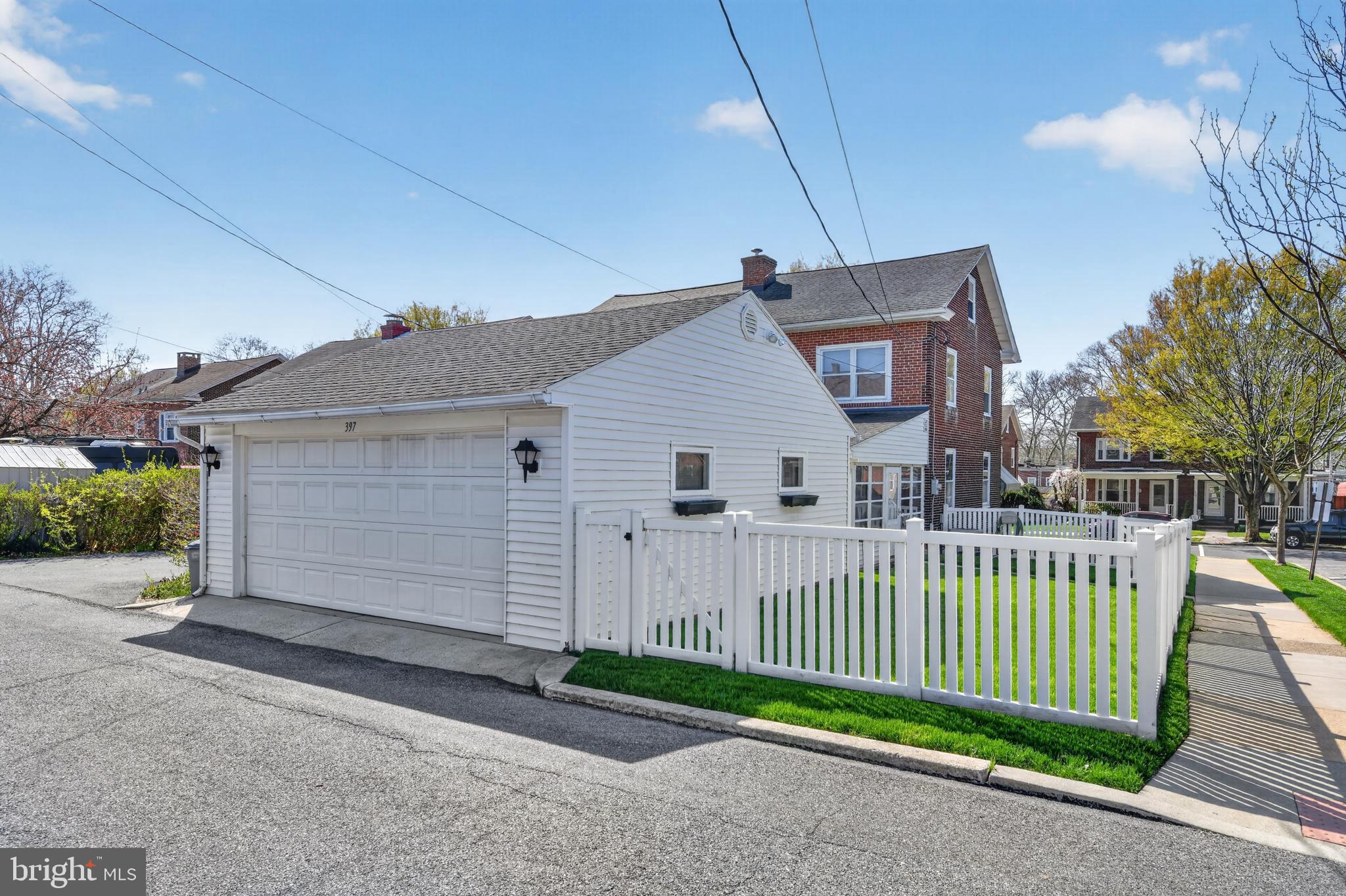 397 Pine Street Reading, PA 19611 - Photo 2 of 42 a view of a house with a small yard and wooden fence