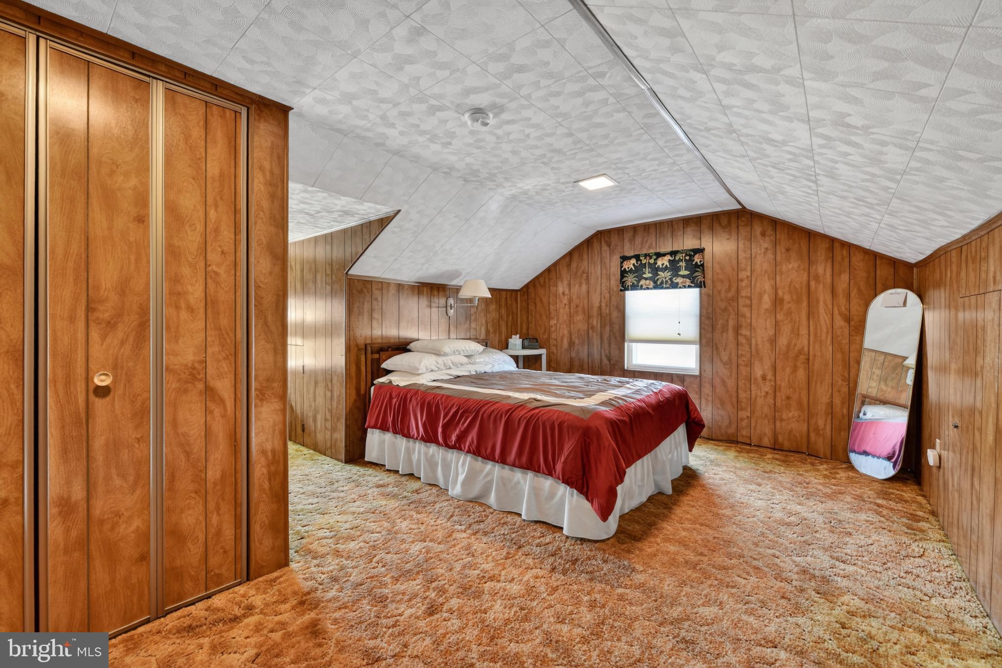 397 Pine Street Reading, PA 19611 - Photo 24 of 42 a spacious bedroom with a large bed and a closet