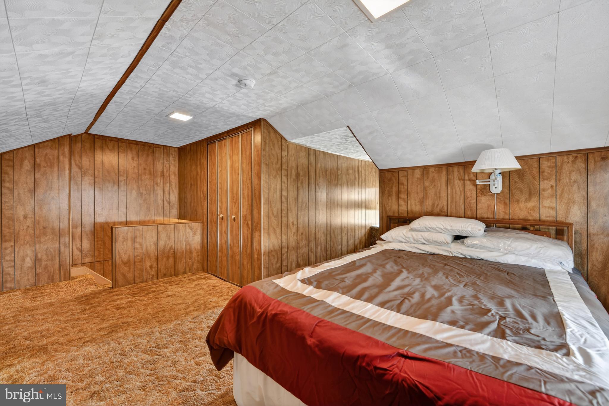 397 Pine Street Reading, PA 19611 - Photo 25 of 42 a bedroom with a bed and a large window
