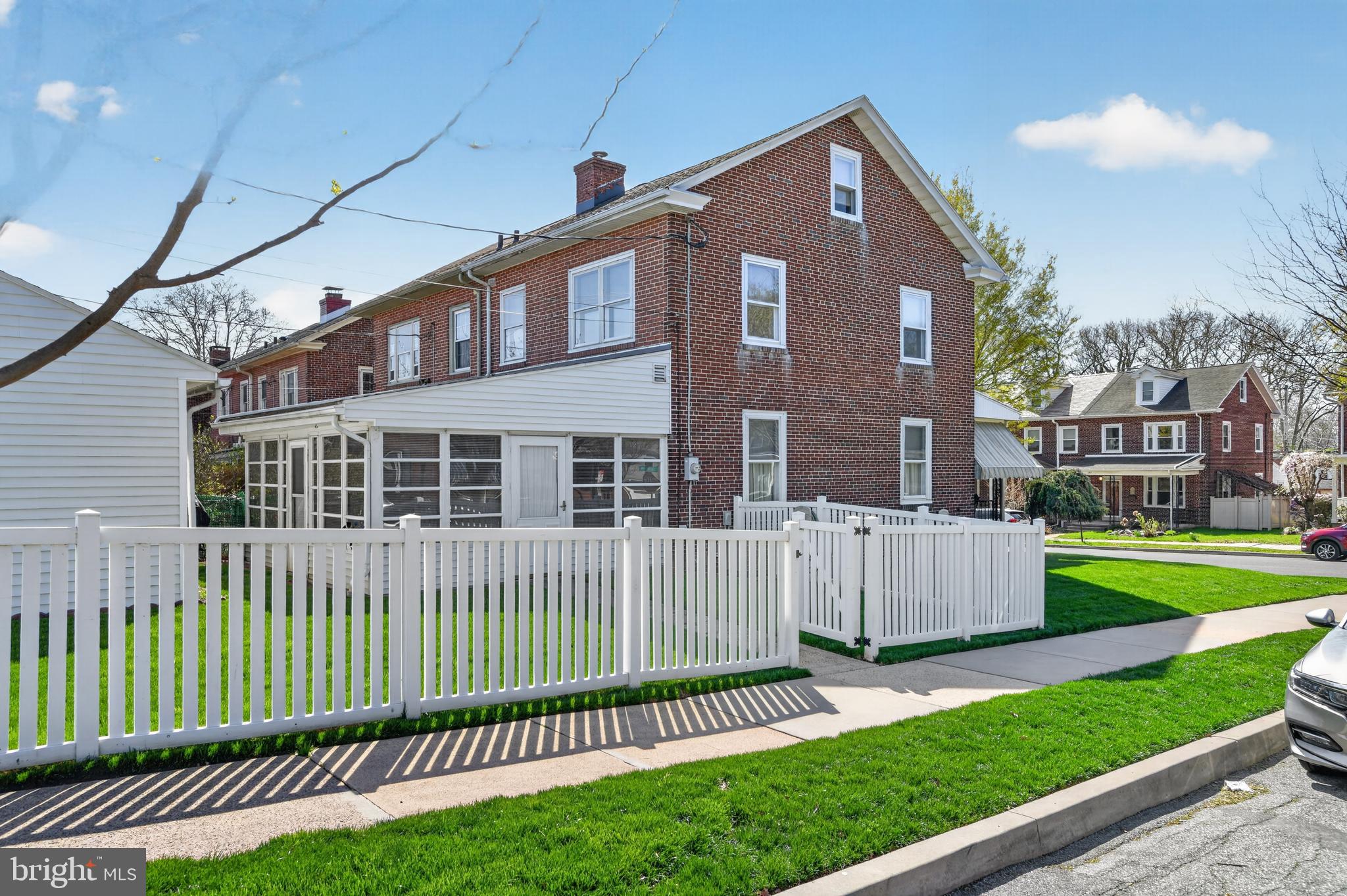 397 Pine Street Reading, PA 19611 - Photo 31 of 42 a front view of a house with a yard and fence
