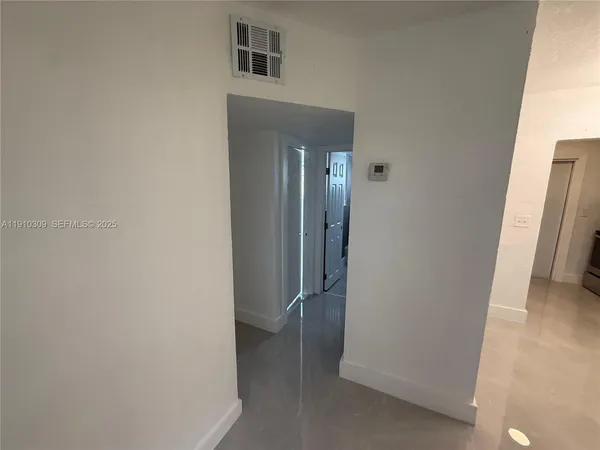 a view of hallway with washer and dryer
