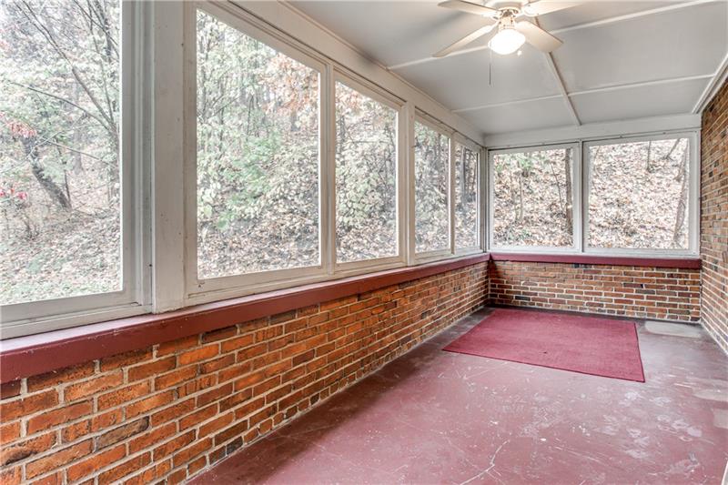 919 Glenfield Road Sewickley, PA 15143 - Photo 14 of 24 This brick screened in side porch is the ideal place to relax or to entertain.