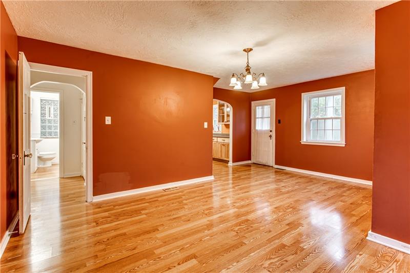 919 Glenfield Road Sewickley, PA 15143 - Photo 8 of 24 Notice the gorgeous flooring, the large windows, and the curved archways. This door next to the kitchen leads to the side porch with a perfect place for your grill.