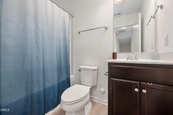 a bathroom with a sink toilet and vanity