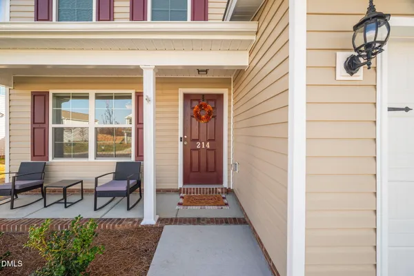 a view of front door and outdoor seating
