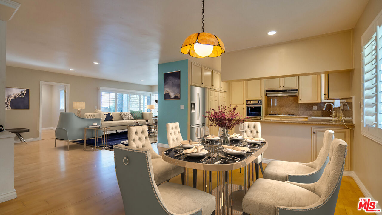 9631 Crystal View Drive Tujunga, CA 91042 - Photo 1 of 57 a kitchen with stainless steel appliances kitchen island granite countertop a stove a sink a refrigerator dining table and chairs