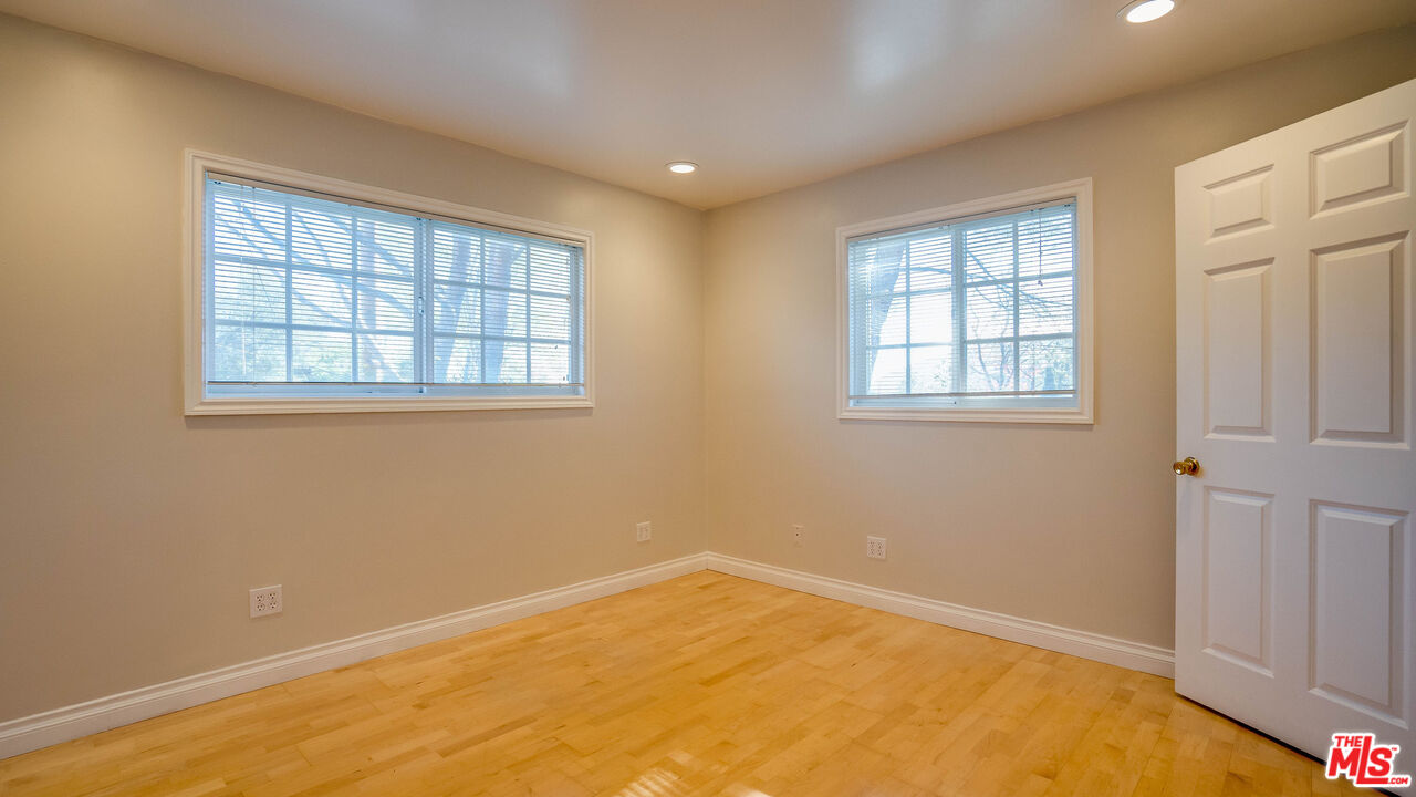 9631 Crystal View Drive Tujunga, CA 91042 - Photo 15 of 57 an empty room with windows