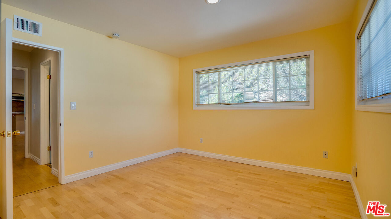 9631 Crystal View Drive Tujunga, CA 91042 - Photo 21 of 57 a view of an empty room with a window
