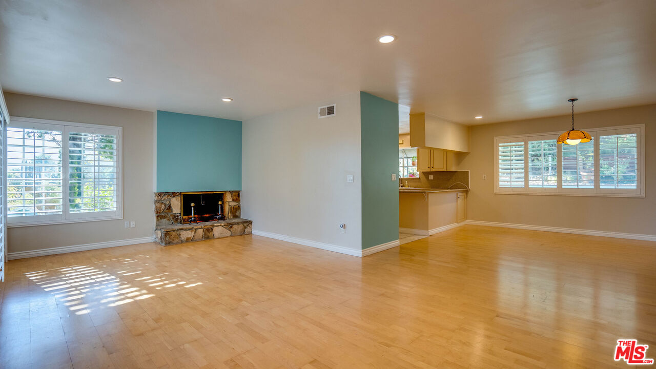 9631 Crystal View Drive Tujunga, CA 91042 - Photo 25 of 57 a view of an empty room with a window and a kitchen