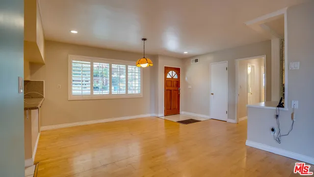 a view of a kitchen with a stove cabinets and a kitchen