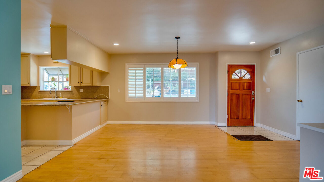 9631 Crystal View Drive Tujunga, CA 91042 - Photo 42 of 57 a kitchen with stainless steel appliances granite countertop a stove a sink and a refrigerator