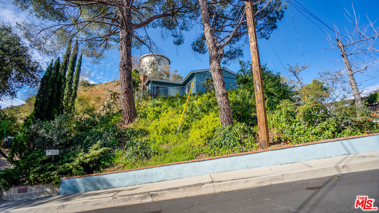 9631 Crystal View Drive Tujunga, CA 91042 - Photo 50 of 57 a view of a bench in front of a building