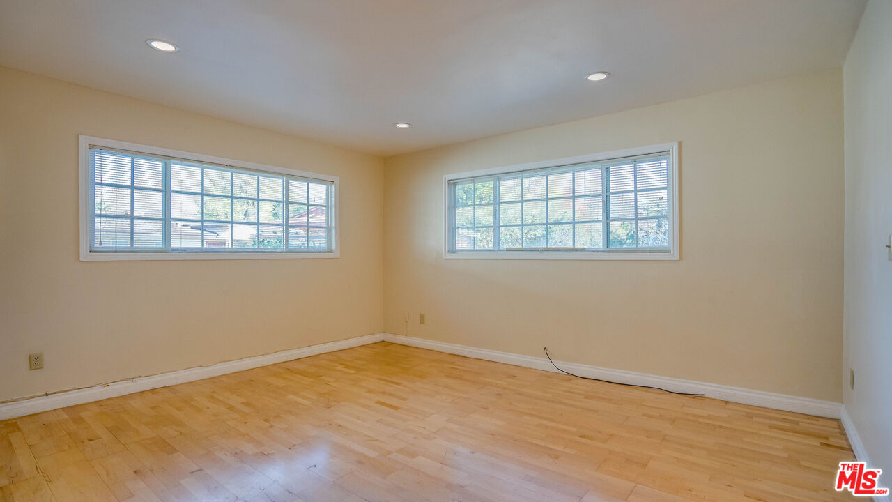 9631 Crystal View Drive Tujunga, CA 91042 - Photo 5 of 57 an empty room with wooden floor and windows