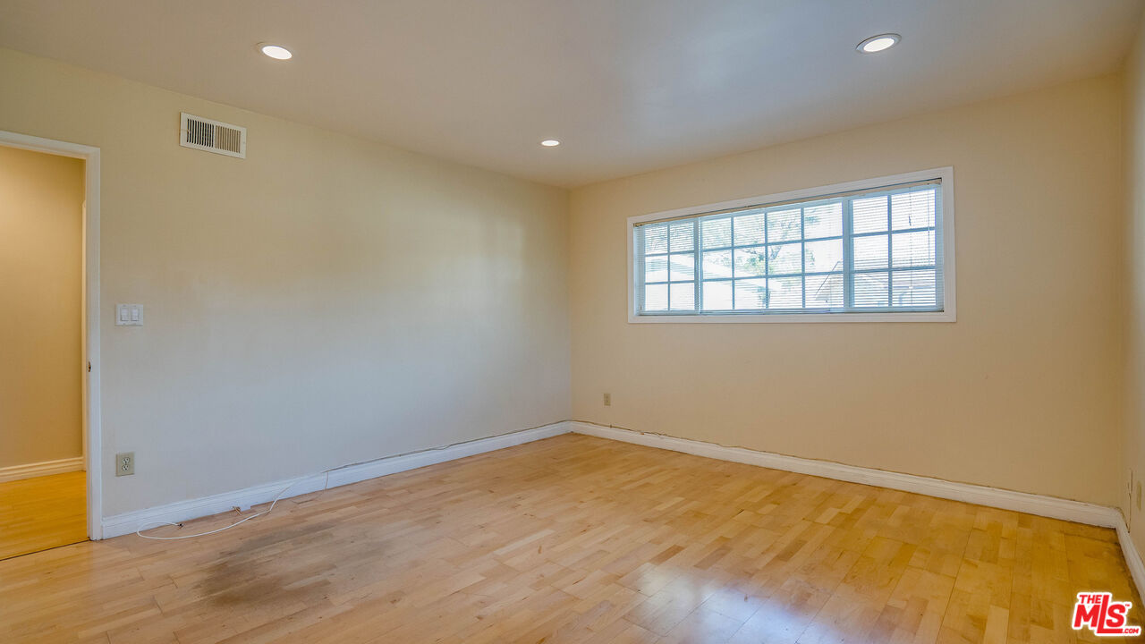 9631 Crystal View Drive Tujunga, CA 91042 - Photo 8 of 57 a view of empty room with wooden floor and fan