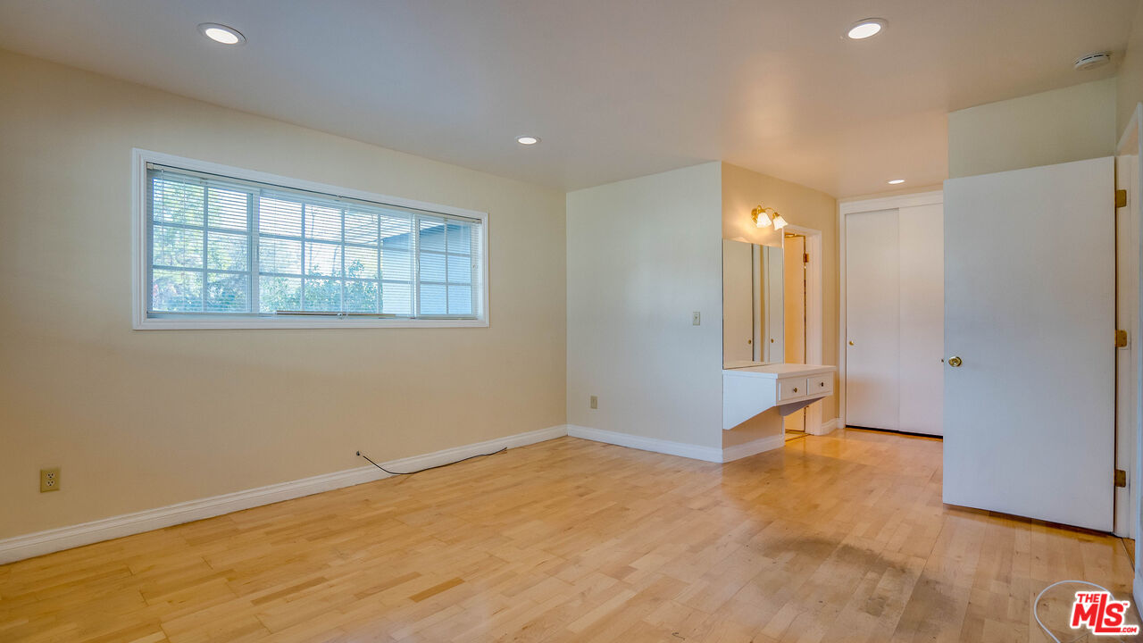 9631 Crystal View Drive Tujunga, CA 91042 - Photo 10 of 57 a view of an empty room with wooden floor and a window