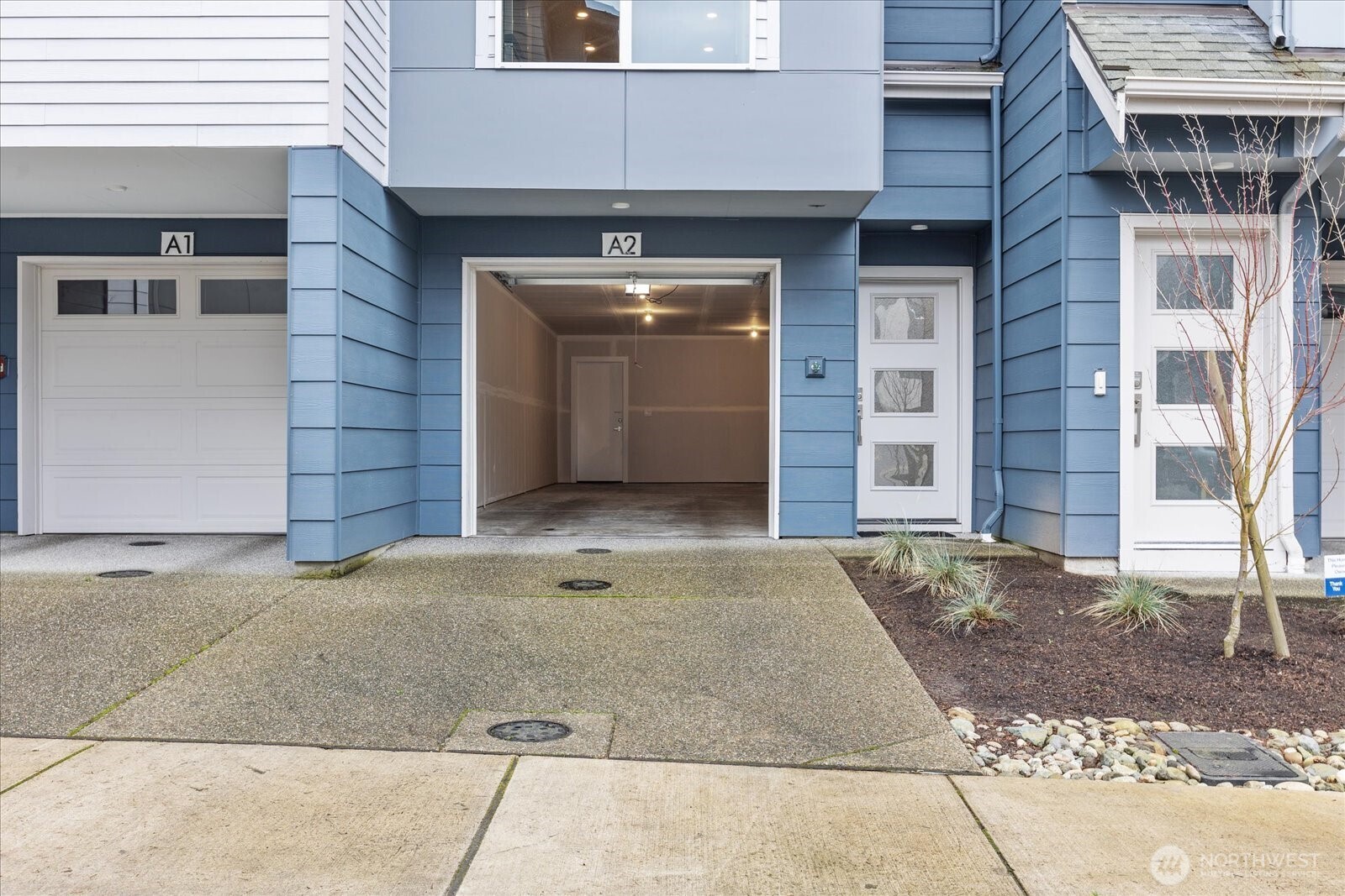 23413 Edmonds Way, Unit A2 Edmonds, WA 98026 - Photo 4 of 40 a view of a brick house with a outdoor space