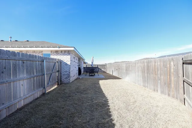 a balcony with table and chairs