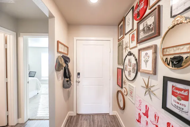 a view of an entryway with wooden floor
