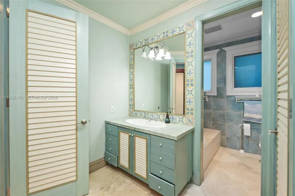 a bathroom with a double vanity sink mirror and
