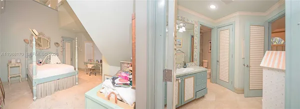 a en suite bathroom with a sink mirror and a bathtub