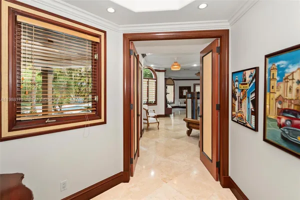 a view of a livingroom with furniture and a large window