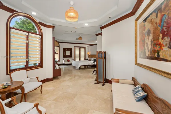 a bedroom with a bed and a tv