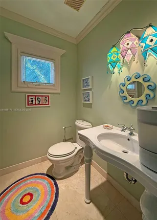 a bathroom with a toilet and a sink