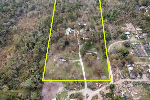 a view of a small pool with a yard