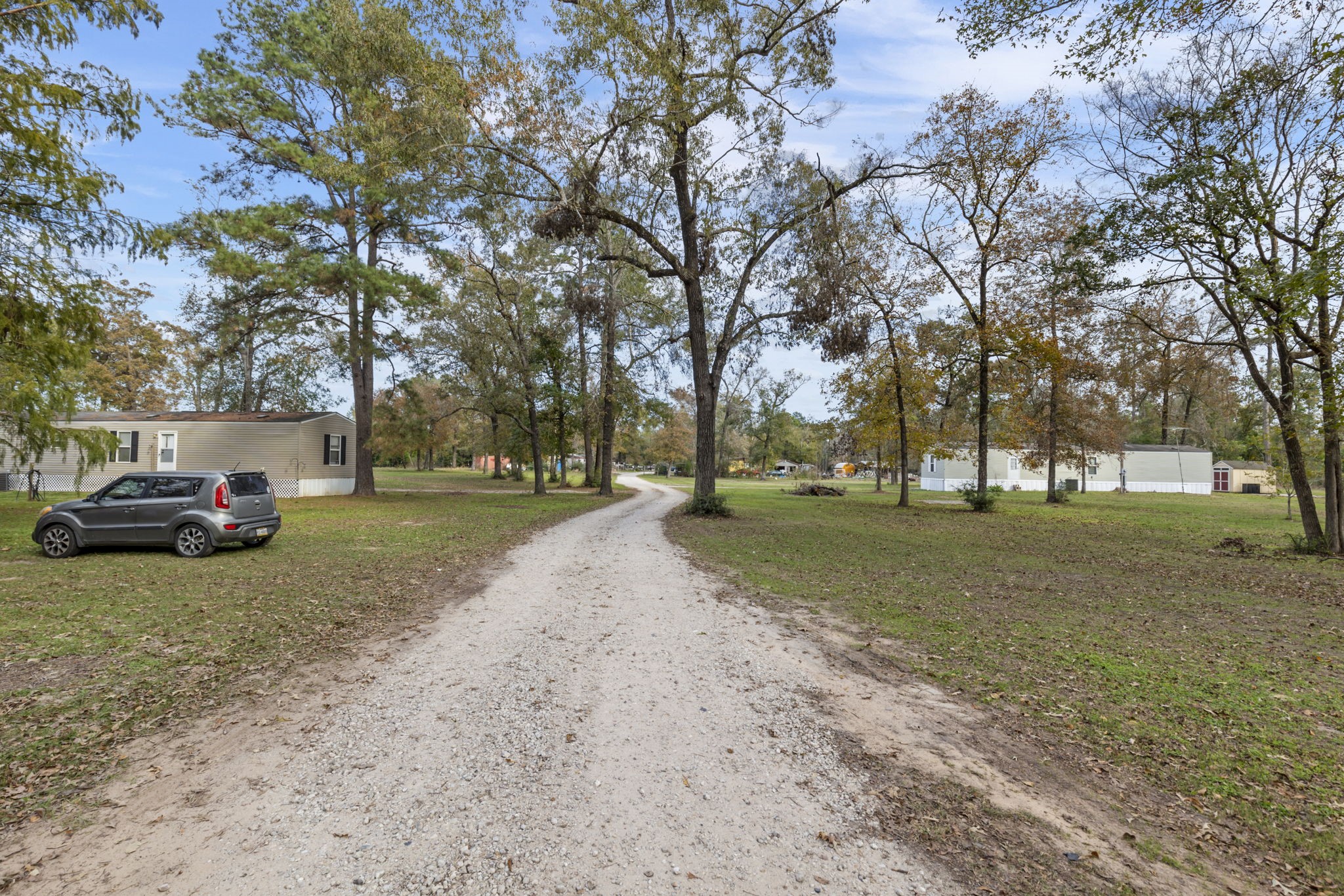 11454 Bonney Conroe, TX 77385 - Photo 3 of 27 a view of road with trees