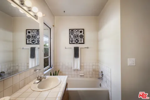 a view of a workspace room with furniture and wooden floor