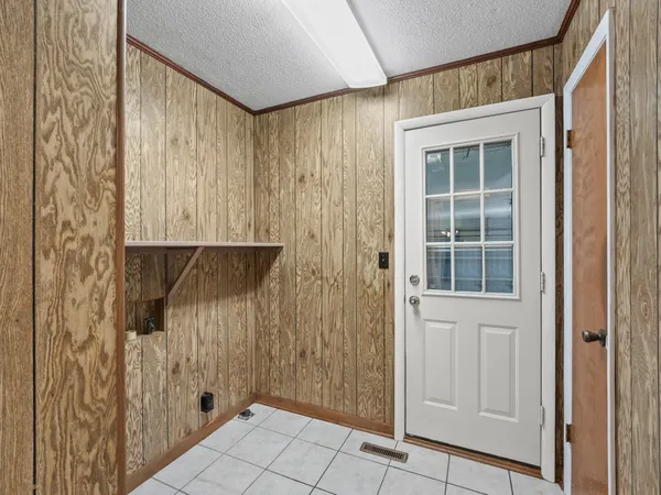 a bathroom with a shower a toilet and a shower
