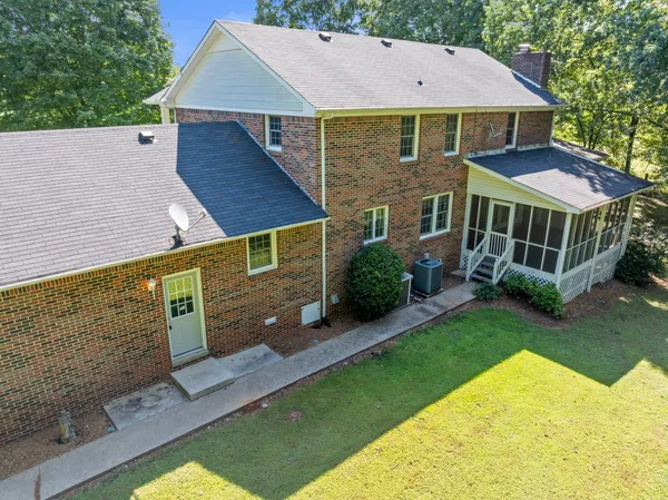 a aerial view of a house with a yard