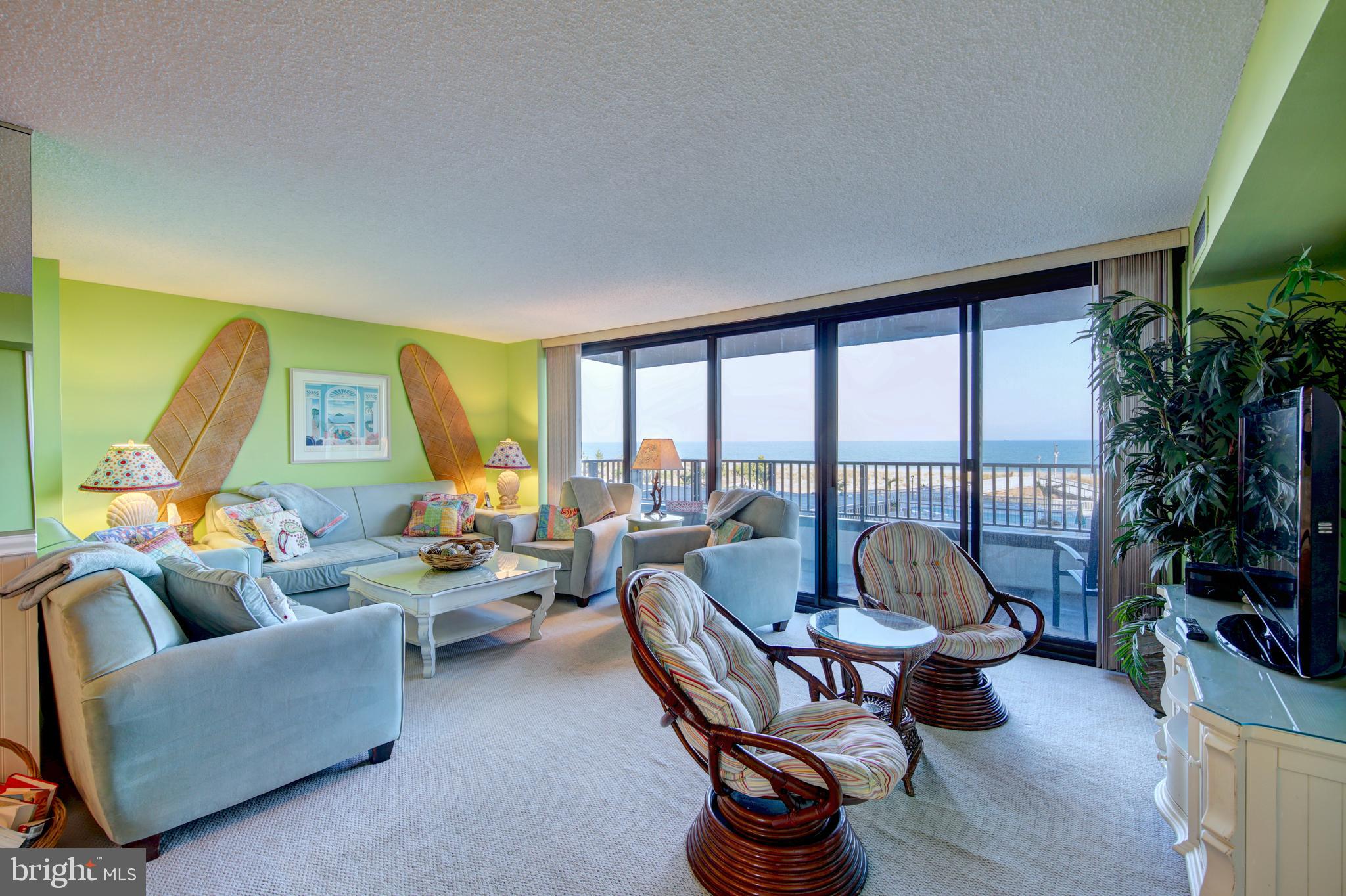 201 South Edgewater House Road, Unit 201S Bethany Beach, DE 19930 - Photo 2 of 50 Wide living room w/ full length picture windows