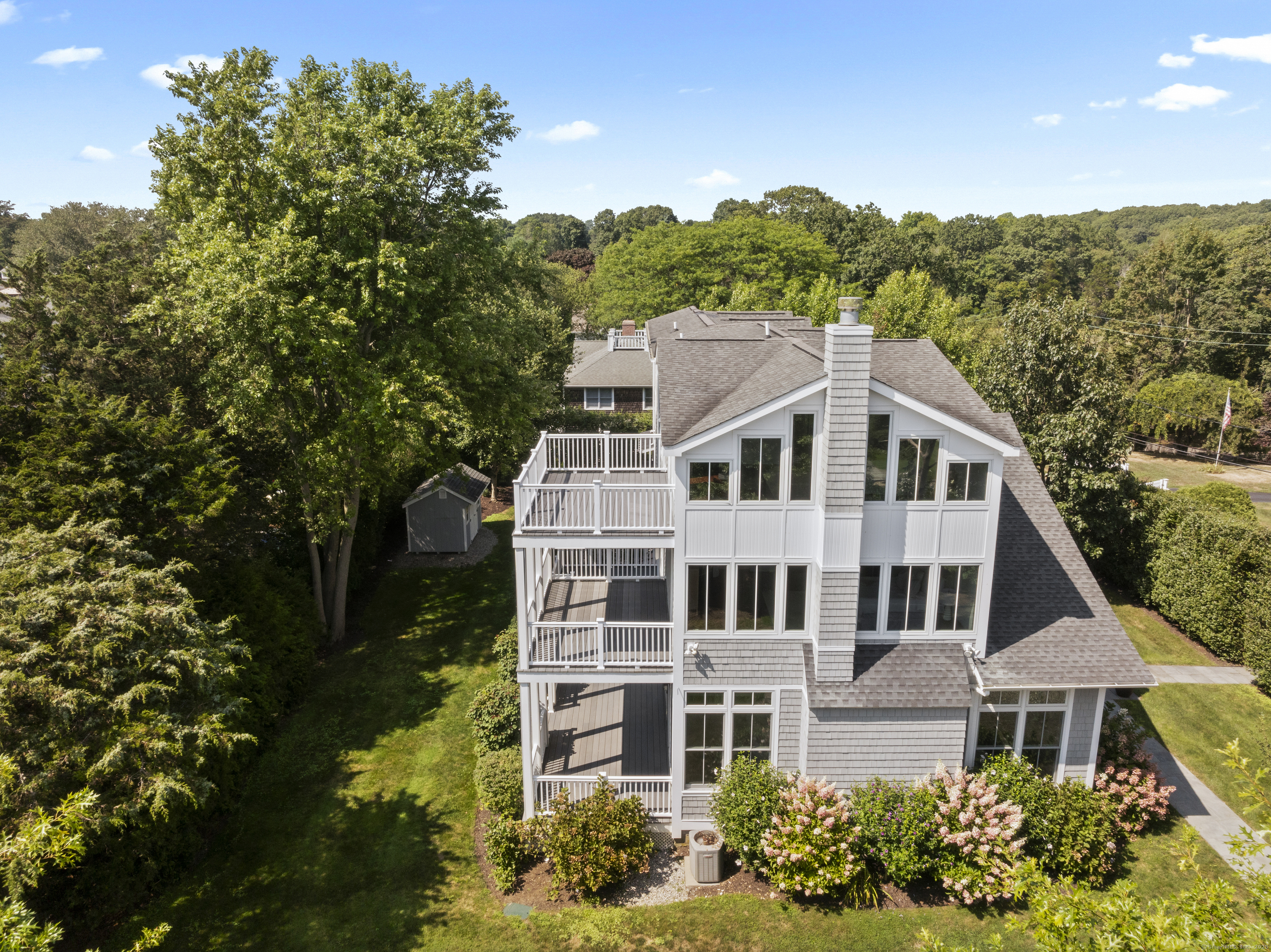 64 Webster Point Road Madison, CT 06443 - Photo 3 of 36 aerial view of a house with a yard and potted plants