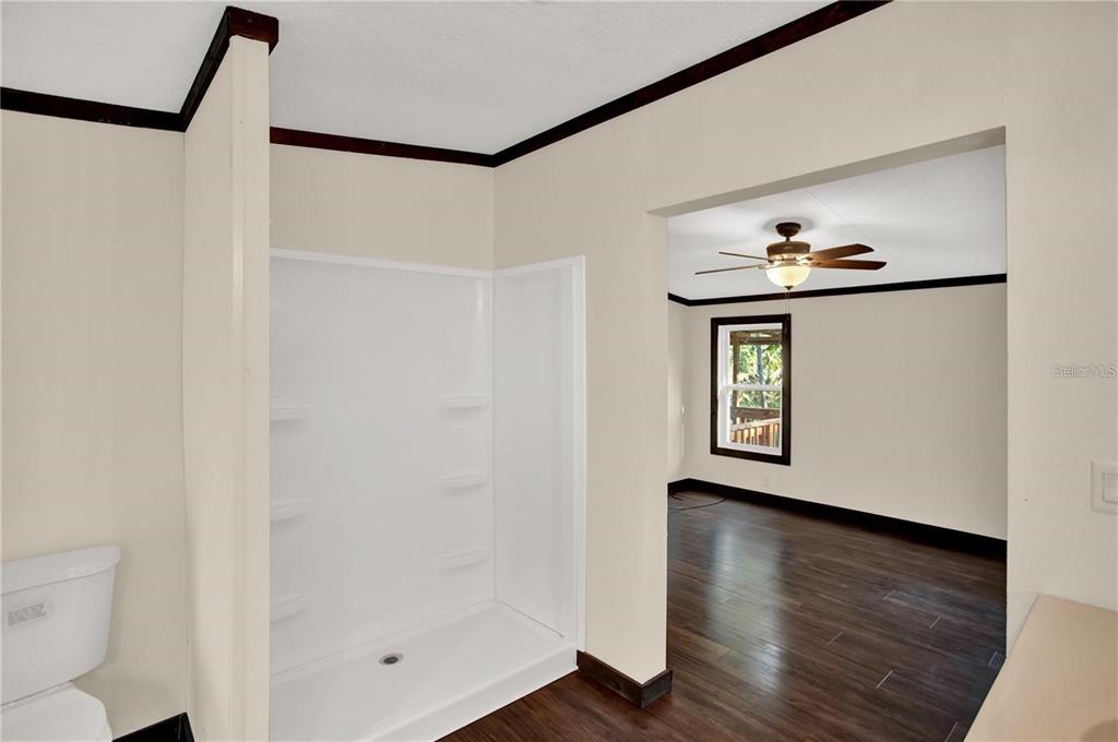10650 Northwest 190th Street Micanopy, FL 32667 - Photo 15 of 31 a view of an entryway with wooden floor