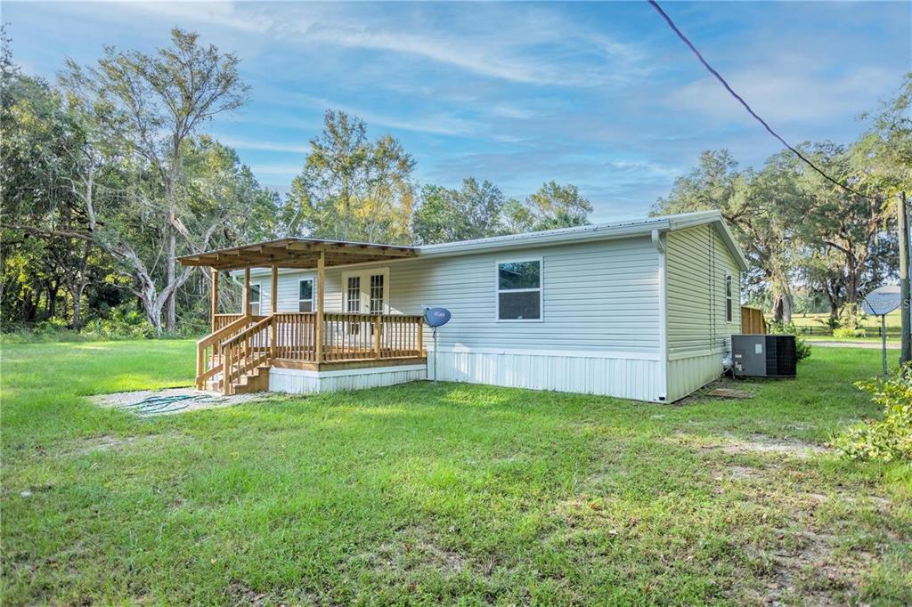 10650 Northwest 190th Street Micanopy, FL 32667 - Photo 31 of 31 a view of a house with a yard