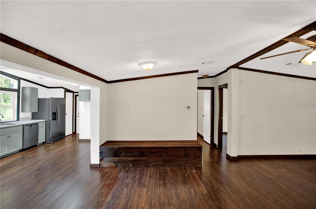 10650 Northwest 190th Street Micanopy, FL 32667 - Photo 5 of 31 wooden floor in an empty room with a window