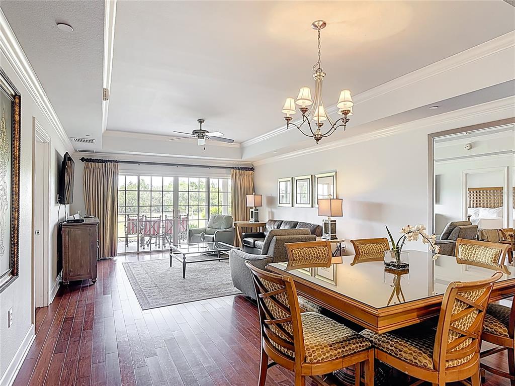 1356 Centre Ct Ridge Drive, Unit 103 Reunion, FL 34747 - Photo 13 of 53 a view of a dining room with furniture window and wooden floor