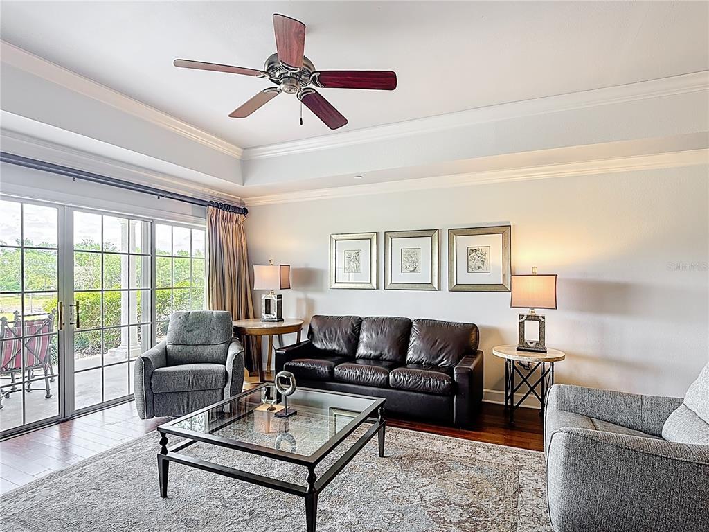 1356 Centre Ct Ridge Drive, Unit 103 Reunion, FL 34747 - Photo 17 of 53 a living room with furniture and a large window